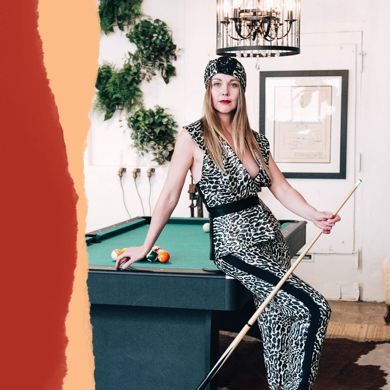 Fashion label brand design portfolio image of an Astille model wearing a leopard print jumpsuit-style set. She poses next to a pool table with the image having torn paper textures around it. 