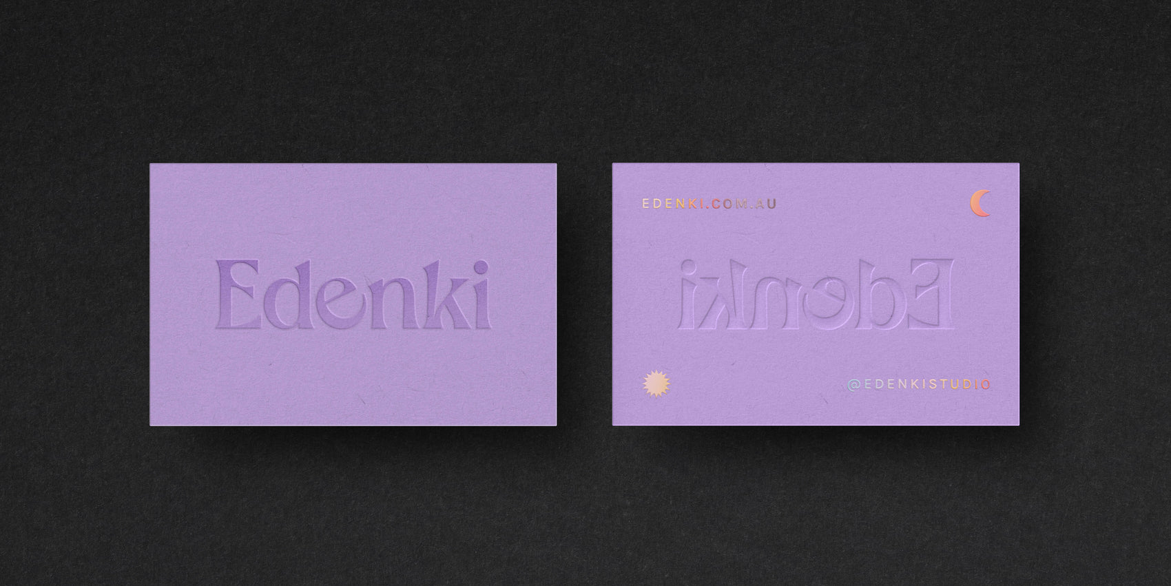 Brand design portfolio image of the Edenki business cards. The pastel purple stock features an embossed Edenki logo and holographic foil detailing on the back. 