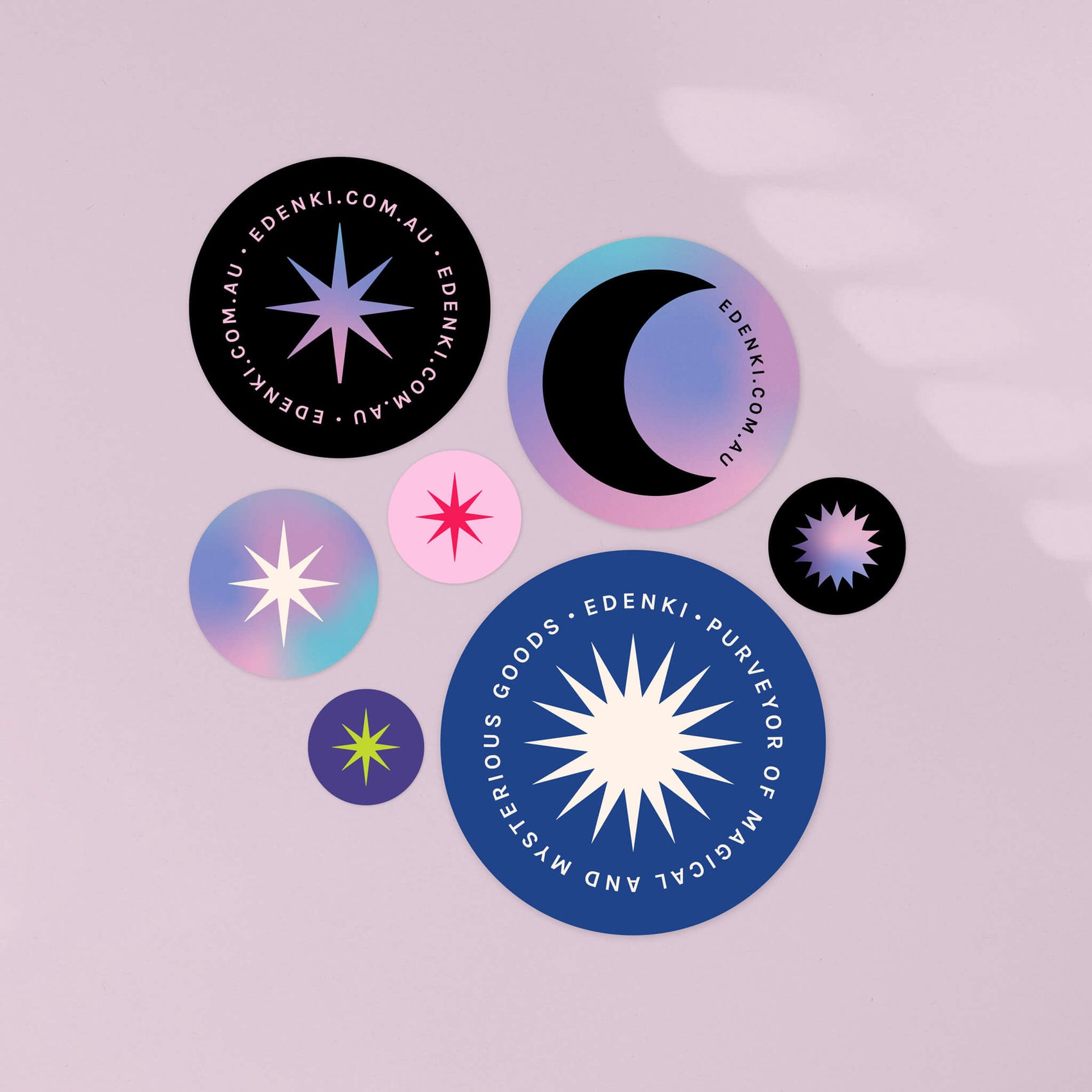 Rebranding jewellery case study image of the Edenki stickers on a light purple background. The stickers show off the cool tones and brand gradient as well as celestial iconography.