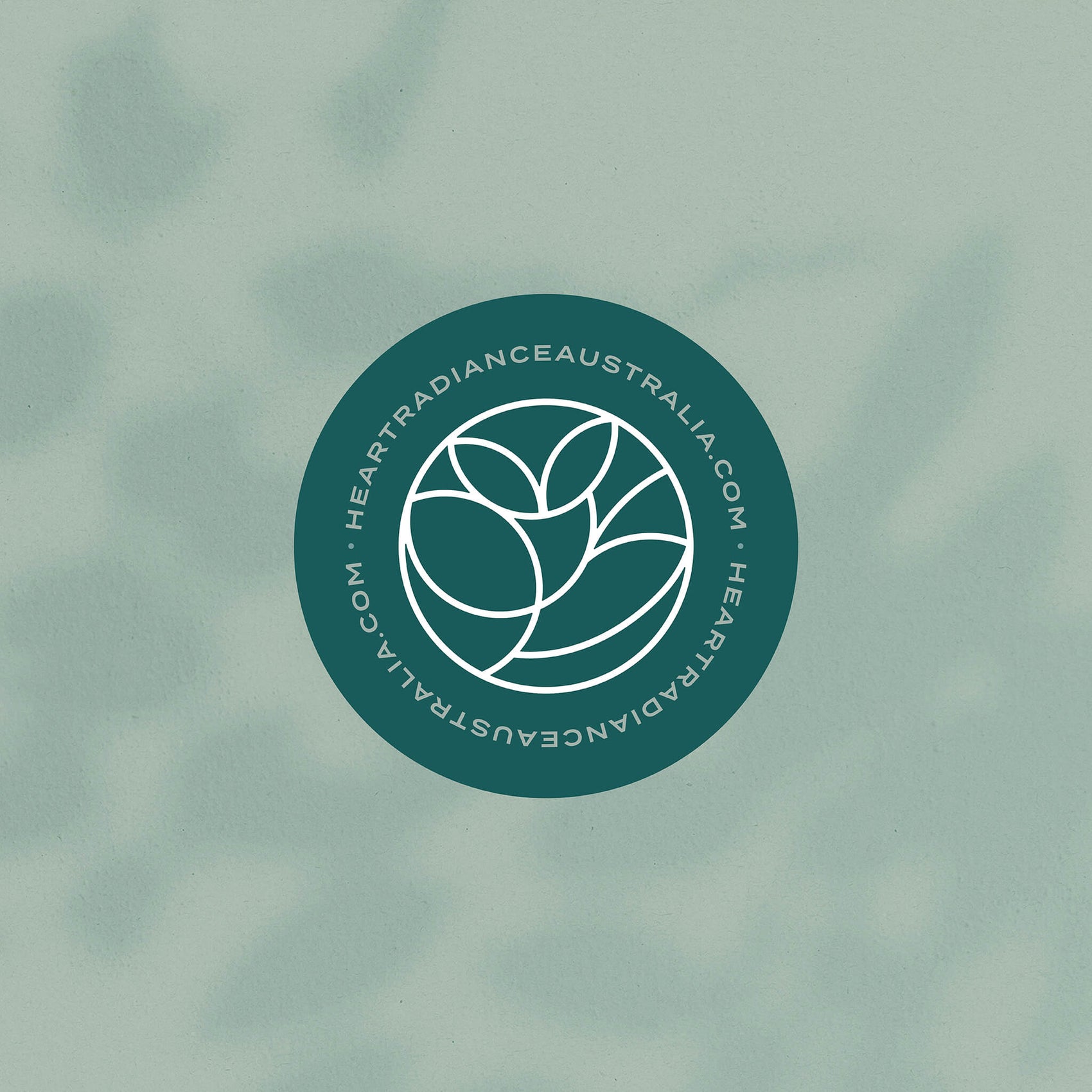 Rebranding case study image of the HeartRadiance custom sticker designs over a green background. The design is in deep green and features the floral brand icon and the URL.