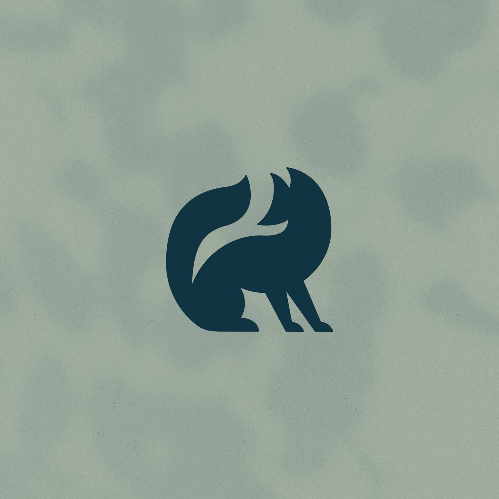 On a shadow-y green background sits the dark green Moss & Brooke fox brand icon. Geometric and contemporary, the branding case study image perfectly matches the tone of the business.