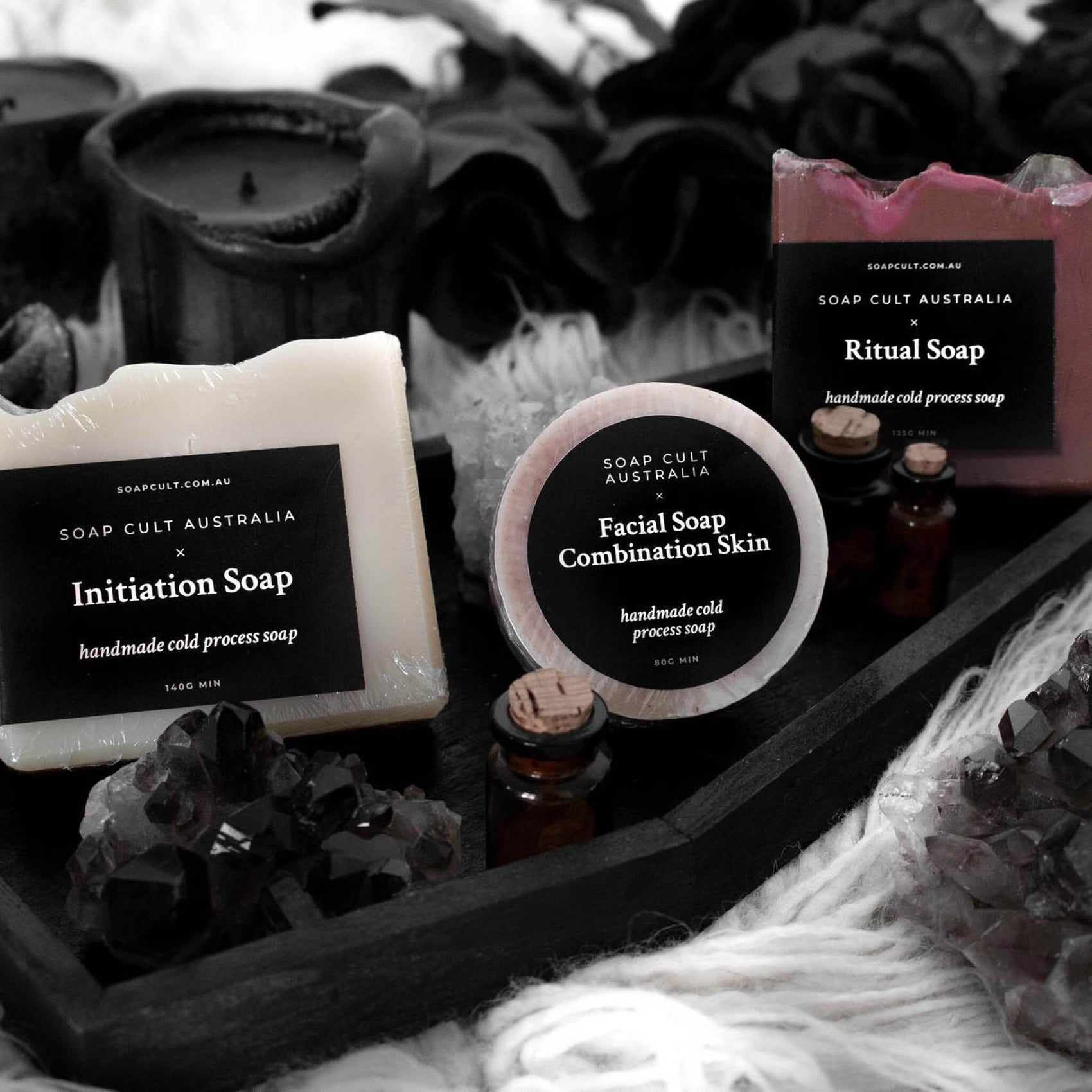Skincare branding case studies image of Soap Cult Australia soaps styled on a wooden soap tray. The soaps feature black custom labels with minimal white typesetting. 