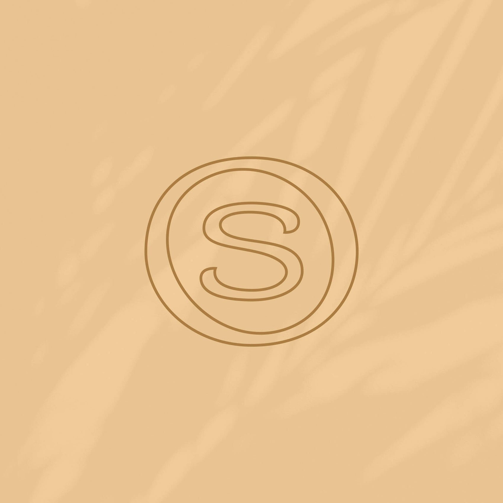 Skincare brand designer portfolio image of the Sonture brand icon in a rich brown on a shadowy apricot coloured background. 