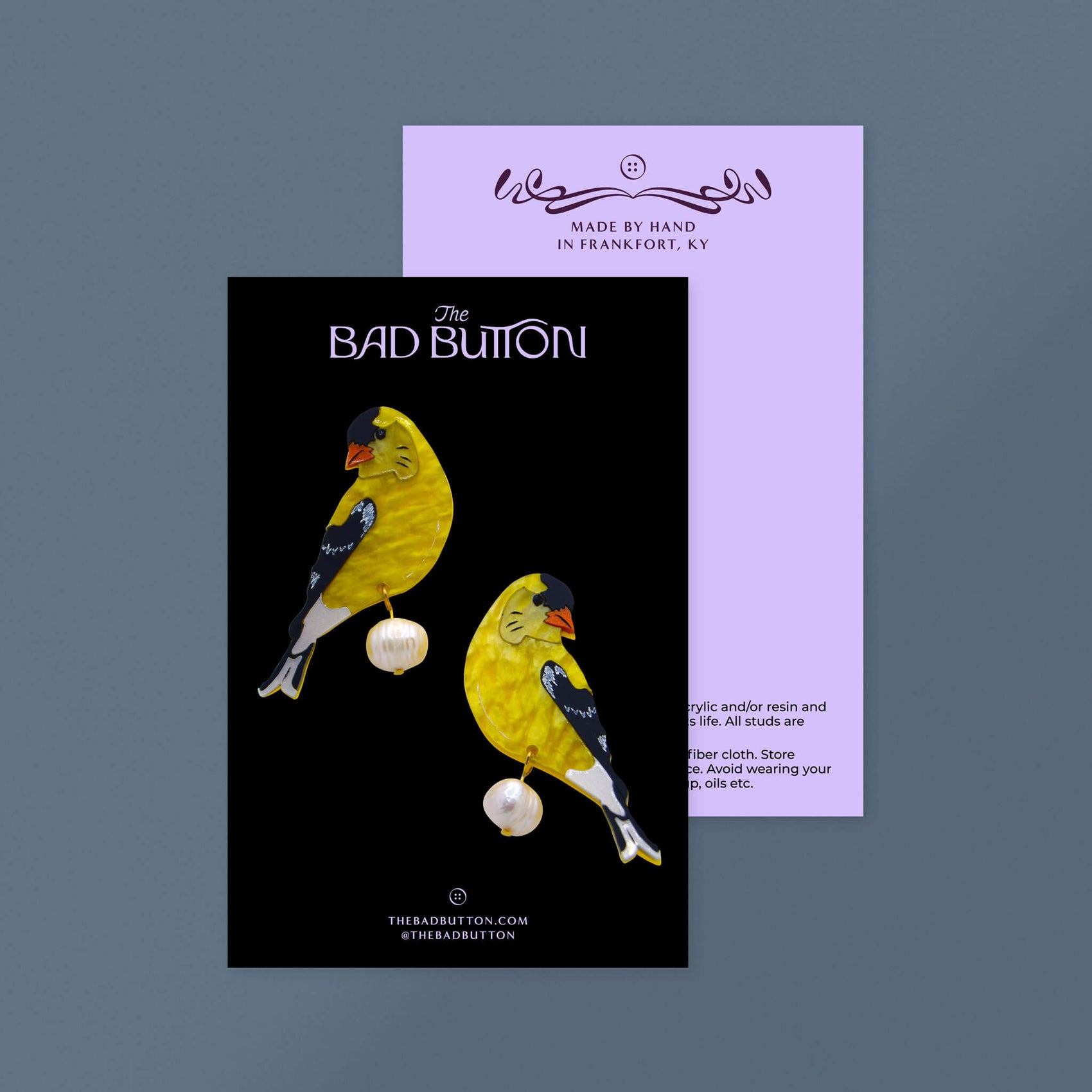 Fashion label brand design portfolio image showcases The Bad Button’s jewellery packaging design in the form of black backing cards. The front features the brand logo, URL and social tags while the back features some of the brand illustrations as a frame as well as care instructions.