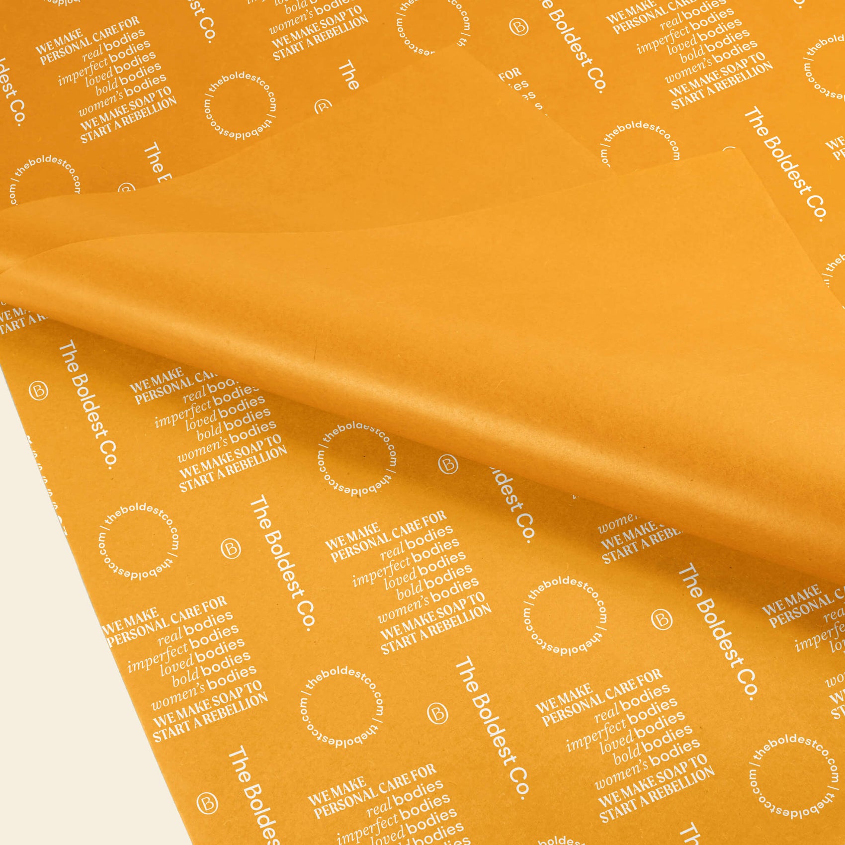 Skincare brand design portfolio image of The Boldest Co’s bright yellow tissue paper. The brand’s values and supporting brand icons appear in white.