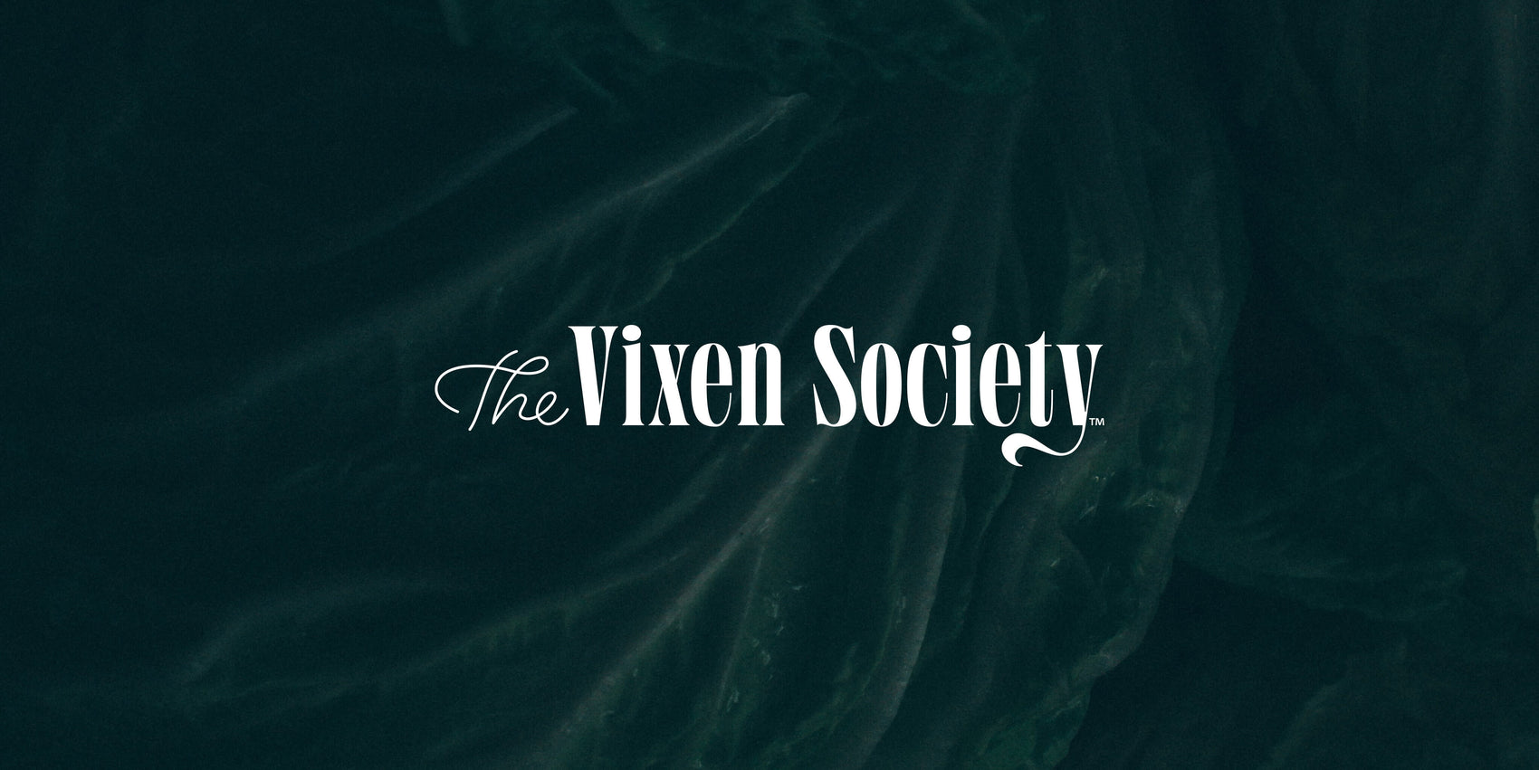 Branding case study image of The Vixen society logo on a deep green textured background. On a black background sits The Vixen Society logo in clean white- a thin monoline cursive 'the' sits aside a lower-case condensed serif with a swooping 'y'.