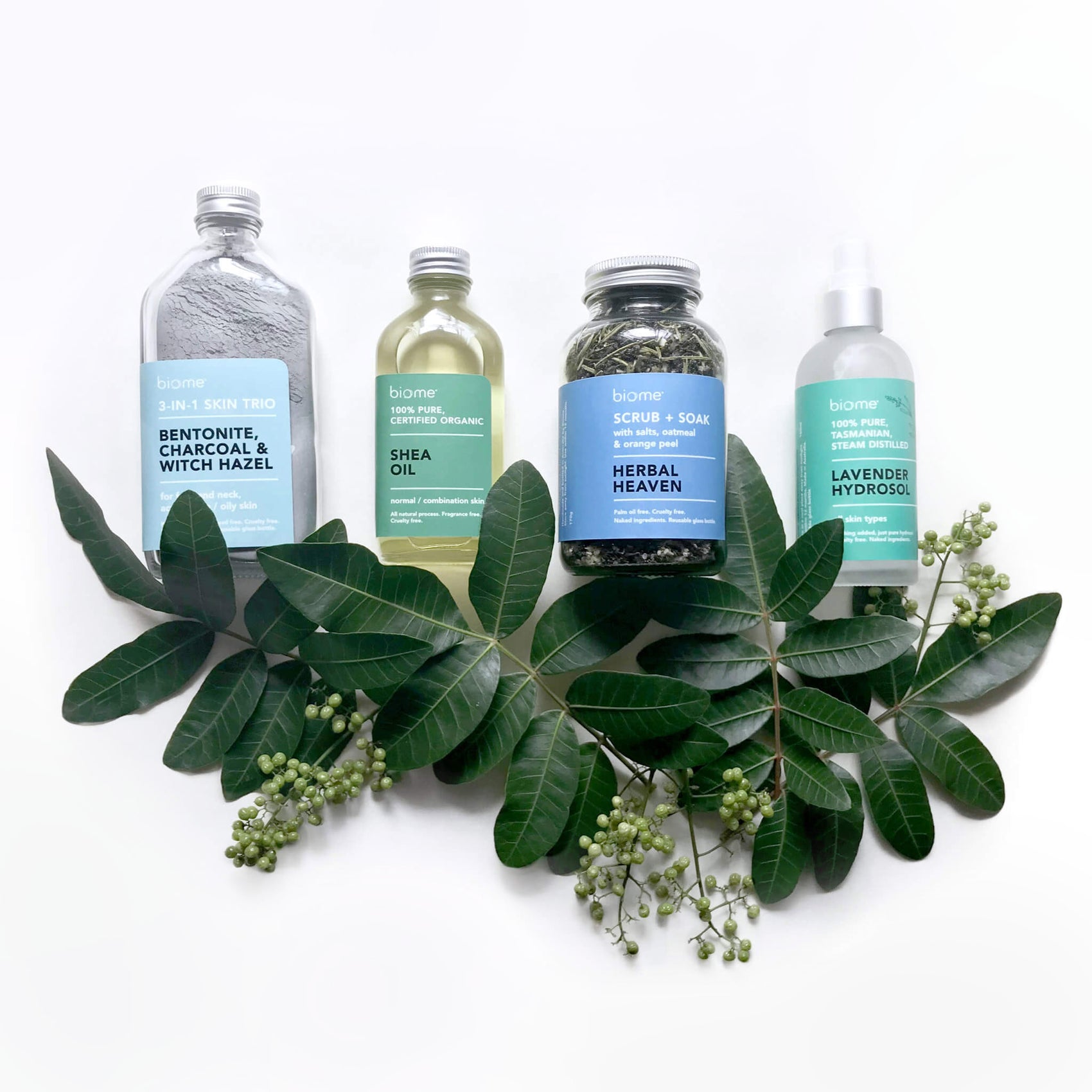 Skincare branding case studies image shows the Biome natural sustainable skincare range. Four products (a bath soak, clay, oil and hydrosol) sit amongst some leaves. 