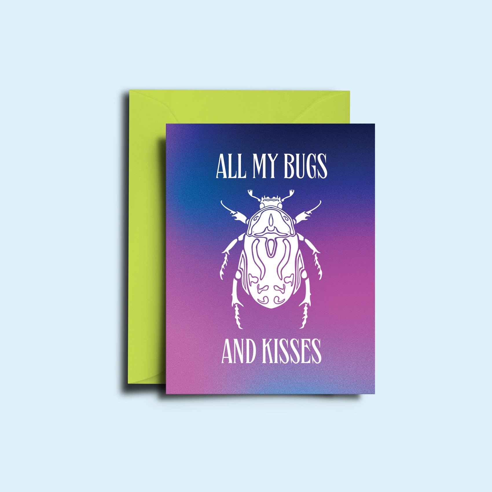 An image of the beetle 'all my bugs and kisses' greeting card alongside it's bright green envelope. The card features a hazy blue and purple gradient with the sharp copy and illustration of a beetle in white.  
